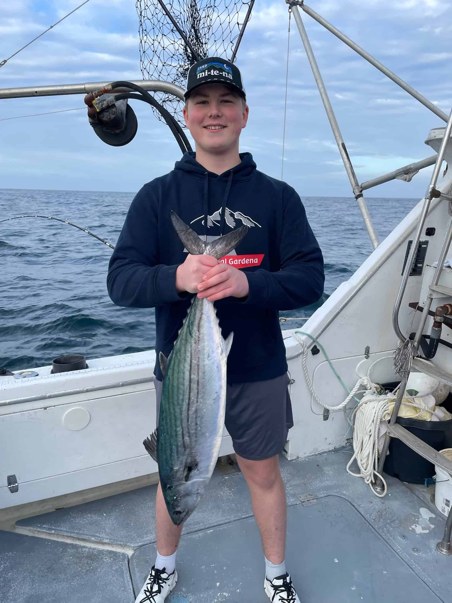 Young angler with caught fish